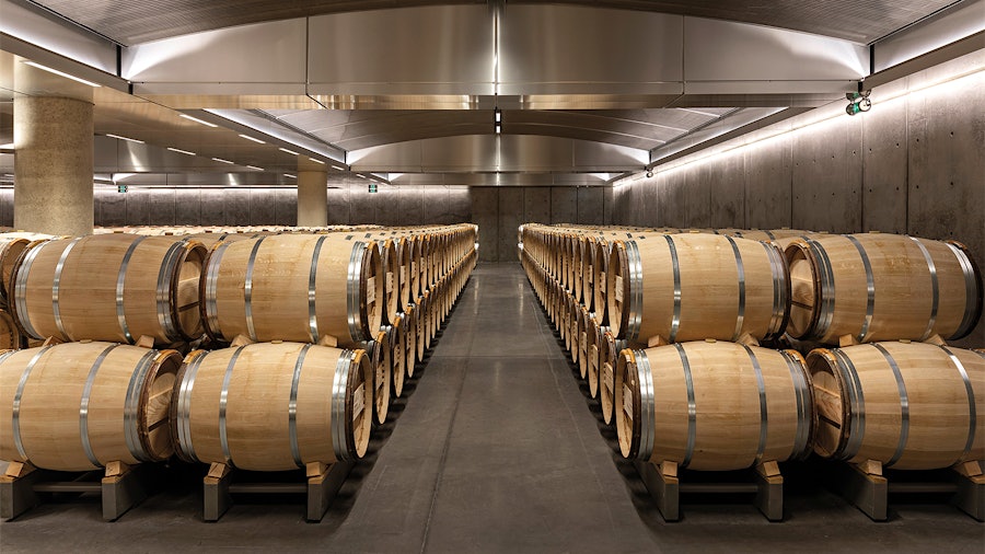 Wine resting in barrels at Château Lynch Bages’ new cellar